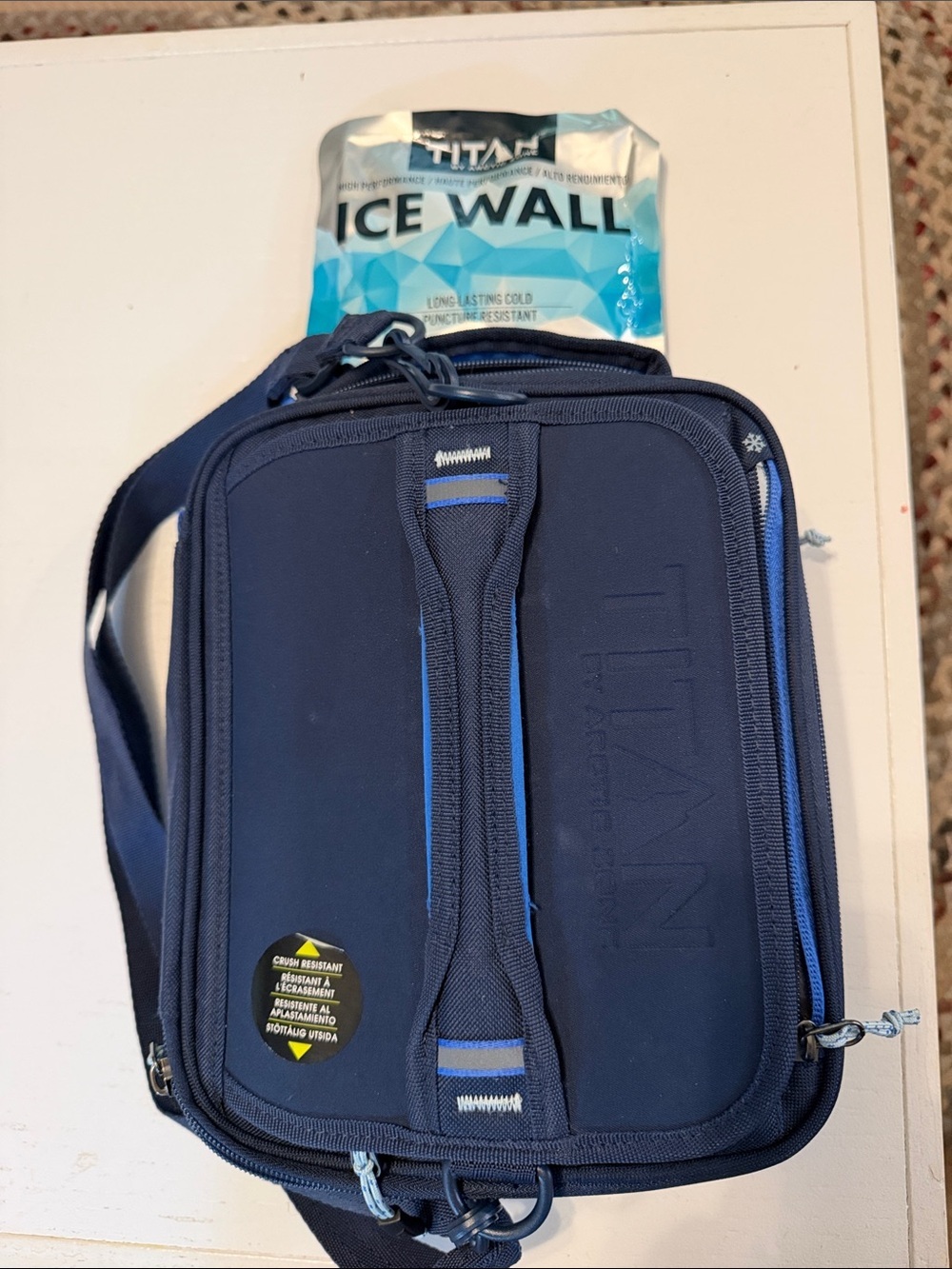 Titan by Arctic Zone expandable lunch box in navy blue.